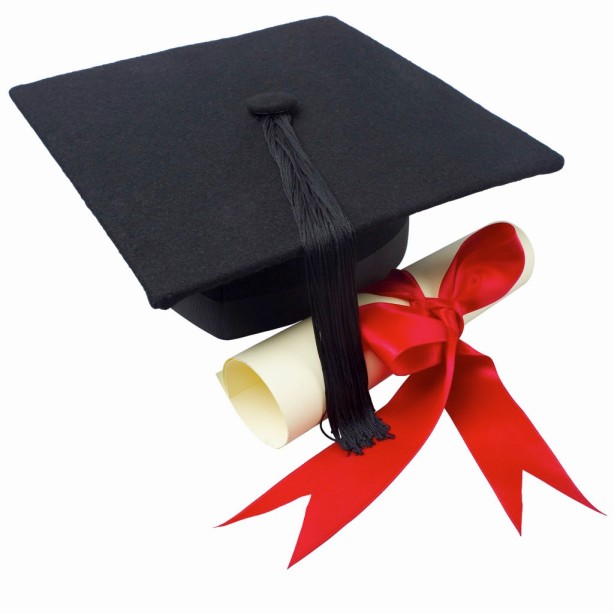 Close up of a graduation cap and a certificate with a ribbon